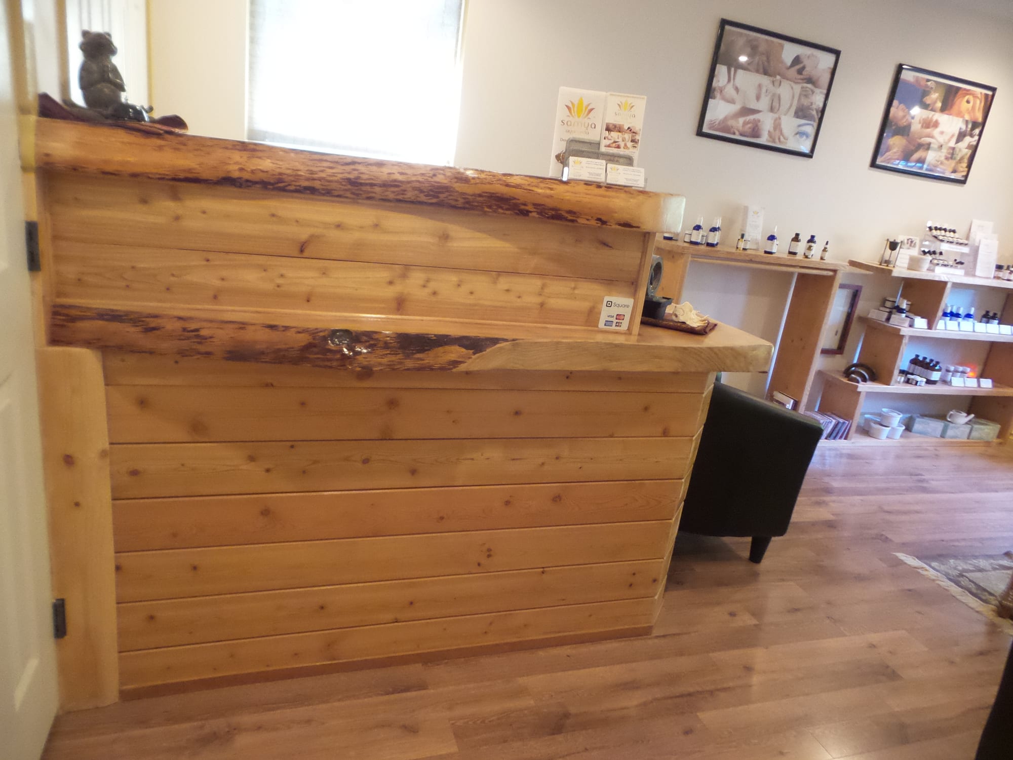 Wellness clinic — custom cedar reception desk with live-edge top